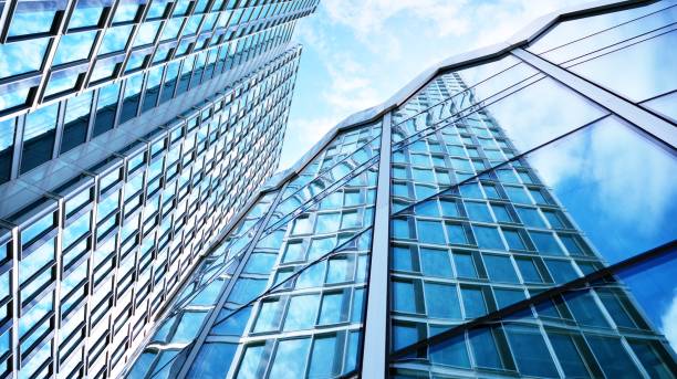 istock Modern office building with glass facade on a clear sky background. 1315797035