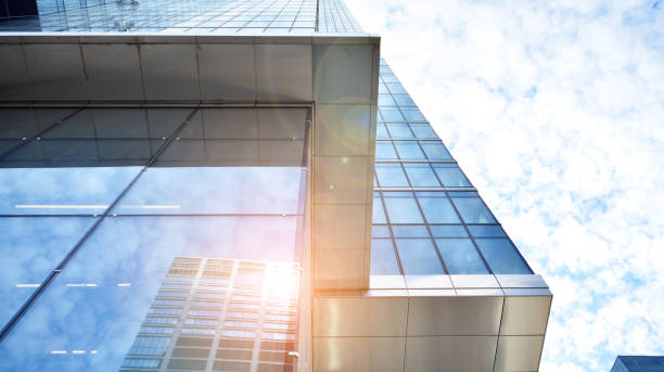 istock Modern office building with glass facade on a clear sky background. 1315798012