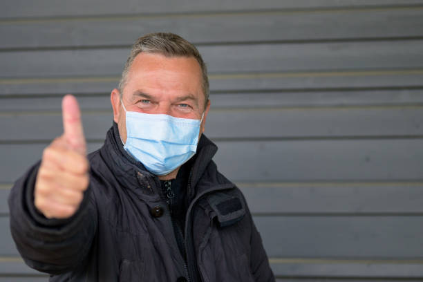 istock Smiling middle-aged man with laughing eyes wearing a face mask 1315798391