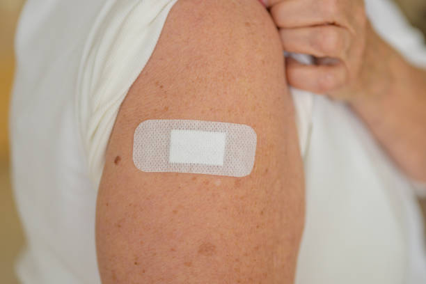 istock Anonymous lady showing the plaster covering her vaccination site 1315798740