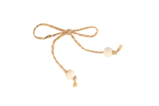 natural rope bow with beads, isolate on a white background - at the end of your rope imagens e fotografias de stock