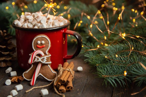 istock cocoa or hot chocolate with marshmallow on rustic table. Christmas or New Year composition. Gingerbread man with candy cane 1315814267