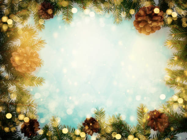 istock christmas background and garland lights with fir branches 1315814868
