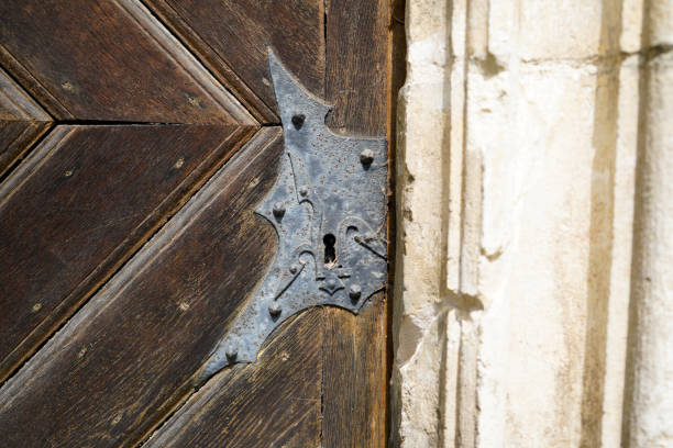 istock Old massive door with decorative door handle and lock, all still functional 1315818283