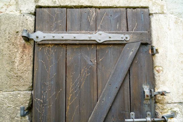 istock Old massive door with decorative door handle and lock, all still functional 1315819128