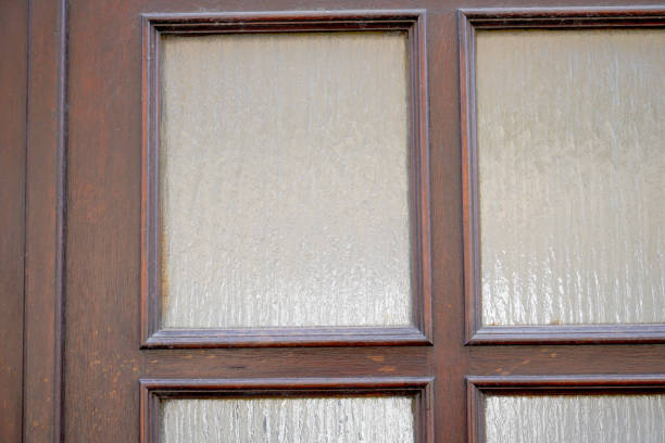 istock Old massive door with decorative door handle and lock, all still functional 1315819173