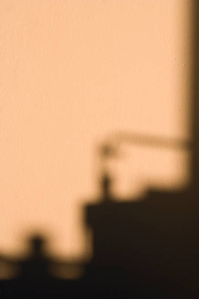 istock An abstract view of the shodow falling on the wall. 1315819224