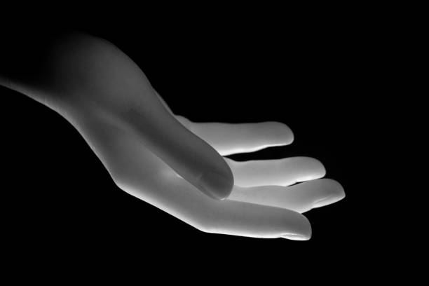 istock Hand of a dummy in front of black background 1315819387