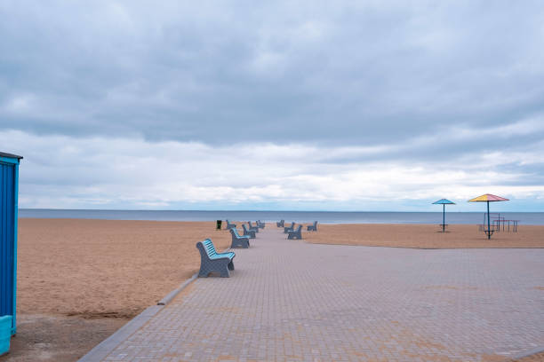 Retro beach with blue benches without people