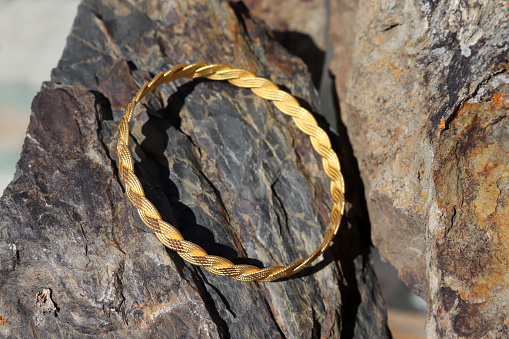 precious gold bracelet on stone