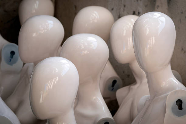Mannequin head on grey background with copyspace