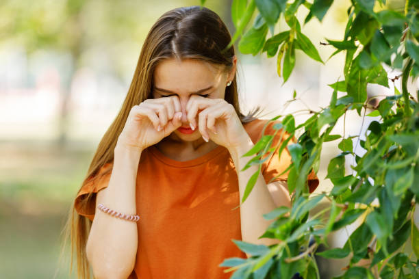 istock Young Woman with Sight Problems is Rubbing her Eyes in a Park. 1315825729