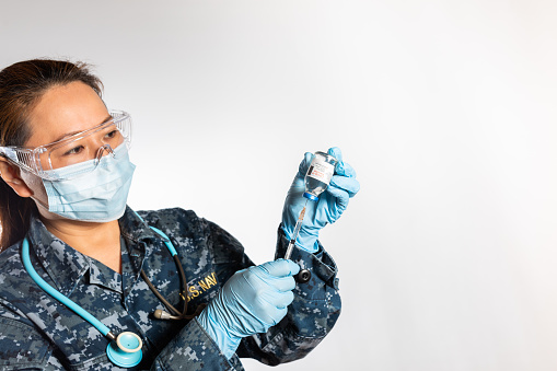 A US Military Navy nurse on white background.