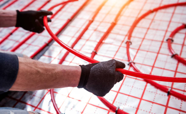 istock Pipefitter install system of underfloor heating system at home 1315829595