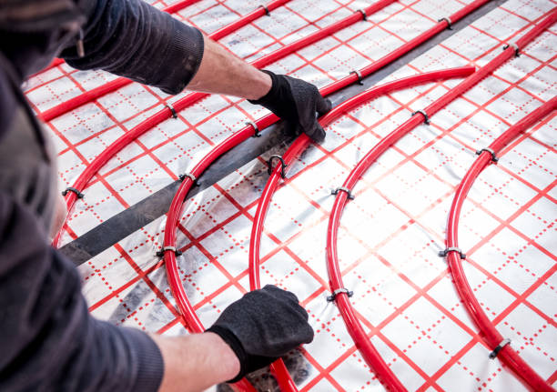 istock Pipefitter install system of underfloor heating system at home 1315830007