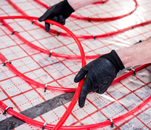 istock Pipefitter install system of underfloor heating system at home 1315830984