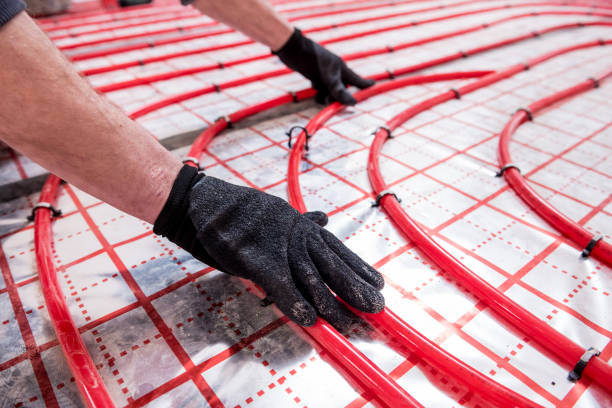 istock Pipefitter install system of underfloor heating system at home 1315831122