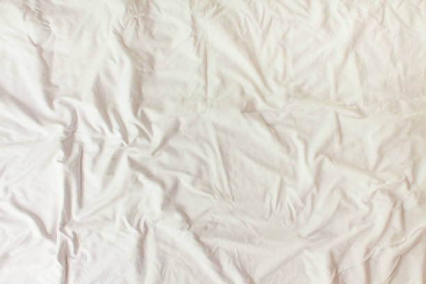 istock Flat layout white background. Modern minimal background with fabric texture and folds of cotton fabric. Top view 1315833907