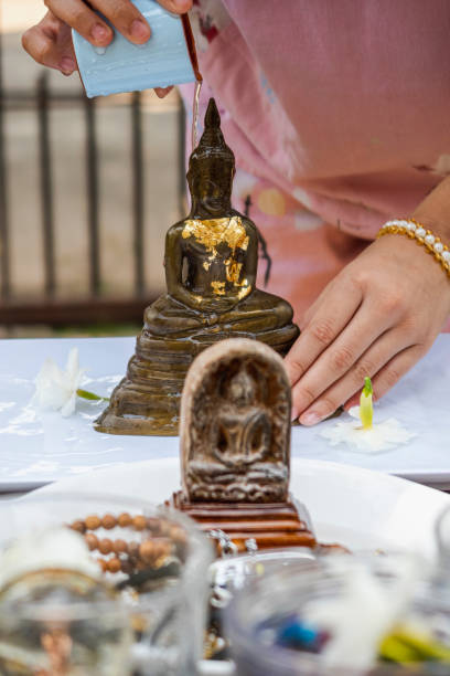 istock pour water on Buddha statue the Thai traditions on Songkran Day 1315841086