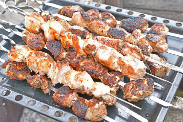 istock Grilled shish kebab on the grill with meat and coals 1315846921