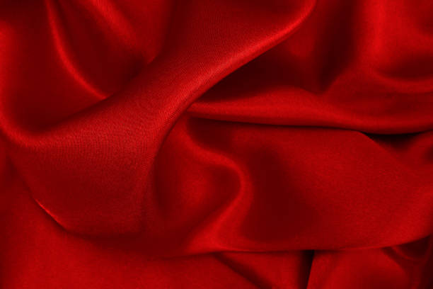 istock Dark red fabric texture background, detail of silk or linen pattern. 1315847294