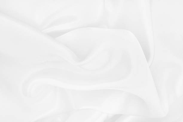 istock White fabric texture background, detail of silk or linen pattern. 1315847318