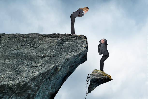 istock Woman Looking Down At Man In Danger 1315849939