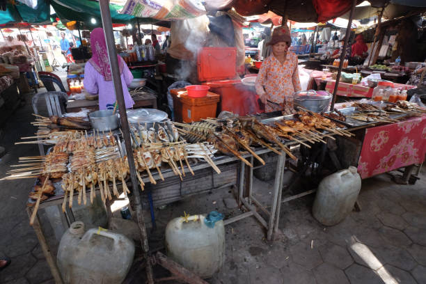 Kep Crab market stall with grilled seafood, Kep, Cambodia Asia At the heart of Kep is a vibrant market that has given this town new life. While most Asian markets lore you in with colorful fruits and elaborate displays of local produce, this market has one purpose: seafood. kep stock pictures, royalty-free photos & images