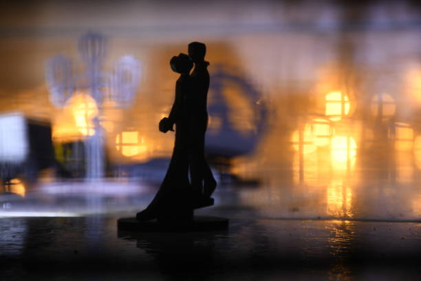 istock Romance silhouettes buy love 1315851809