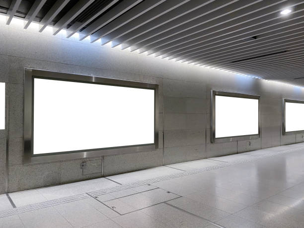 istock Blank billboards of advertising space for mock up purpose, OOH ad placement. Large format poster space at pedestrian walkway of MRT train station 1315854206