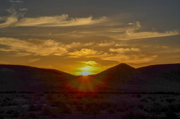 istock Sunrise with wispy curly clouds near Moab, Utah 1315854801