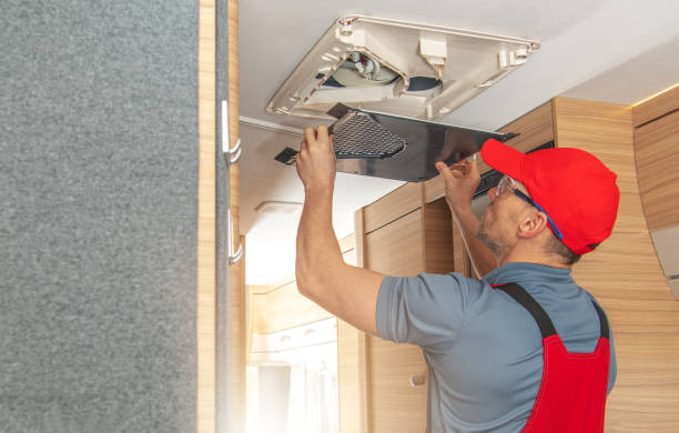 men repairing air condition unit inside modern travel trailer - rving imagens e fotografias de stock