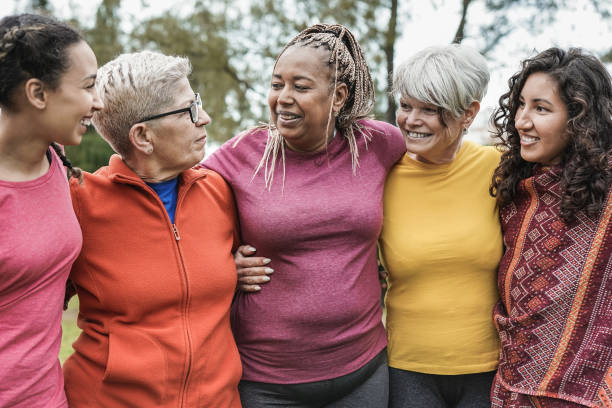 istock Happy multi generational women hugging each other at park - Multiracial people having fun together outdoor 1315858103