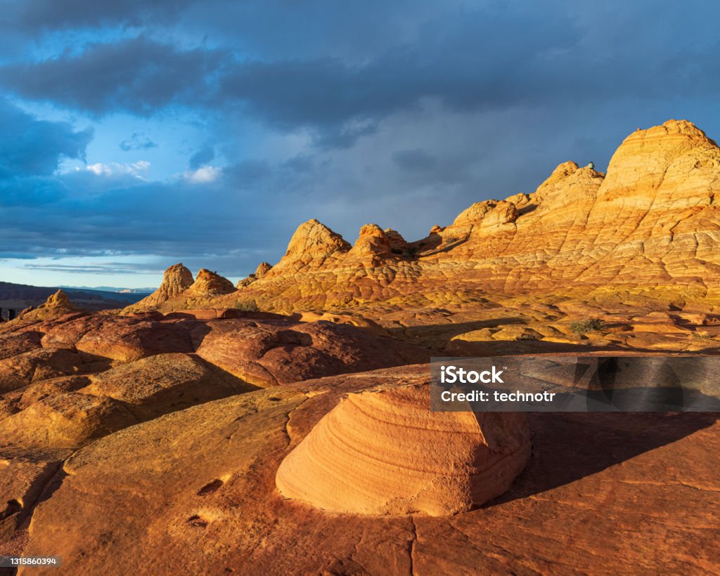 Rock Formations at Coyote Buttes South in Arizona at Sunset Colorful rock formations at Coyote Buttes South in Arizona Coyote Buttes Stock Photo