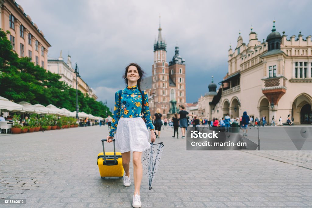 Tourist exploring the best of Europe Traveler exploring Poland, Krakow city, Rynek Glowny square Poland Stock Photo