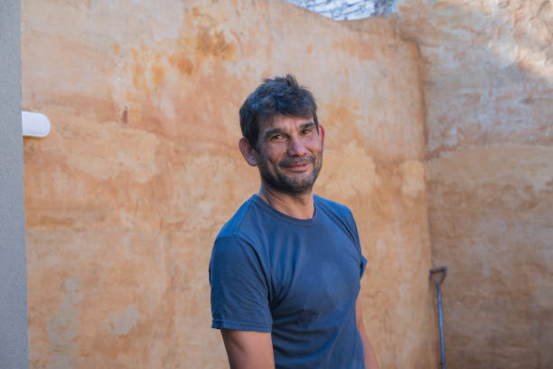 istock Portrait of contruction worker digging hole at house backyard 1315862550