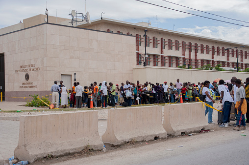 Haitian people queue for visas at the USA Embassy in Port-au-Prince, Haiti after the earthquake in January 2010