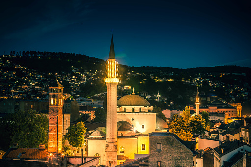 A famous Gazi Husrev-beg Mosque in Sarajevo built in the 16th century illuminated at night.