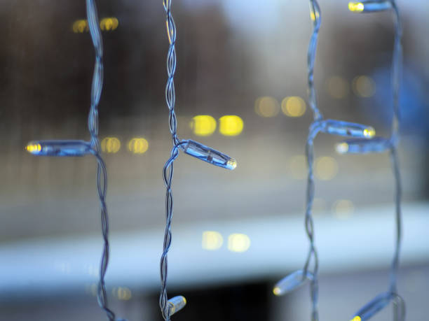istock Garlands on the window. Blurred background. Close-up. 1315867739