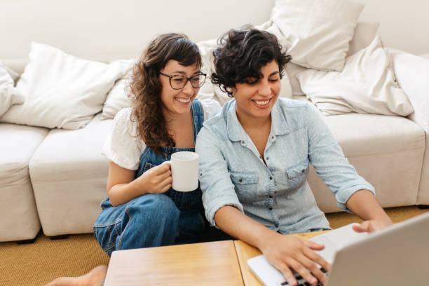 istock Lesbian couple at home with laptop 1315870587