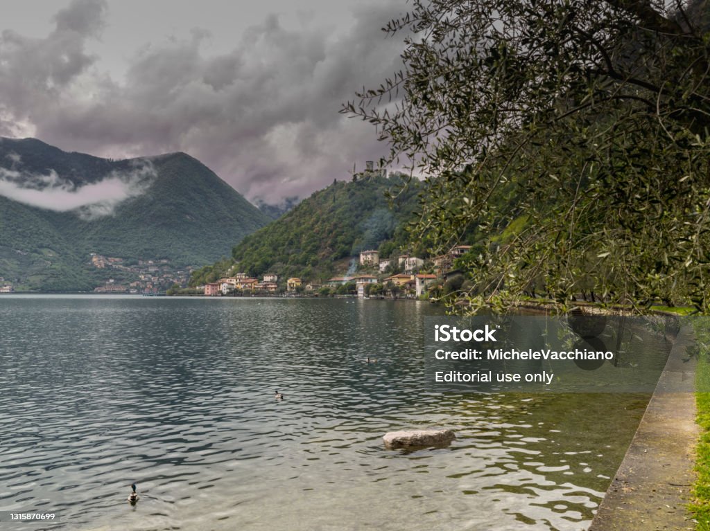 Island of Monte Isola, Lake Iseo, Italy Monte Isola, Italy - April 30, 2021: Overlook on Lake Iseo and Monte Isola, the largest lake island in Europe. Island Stock Photo