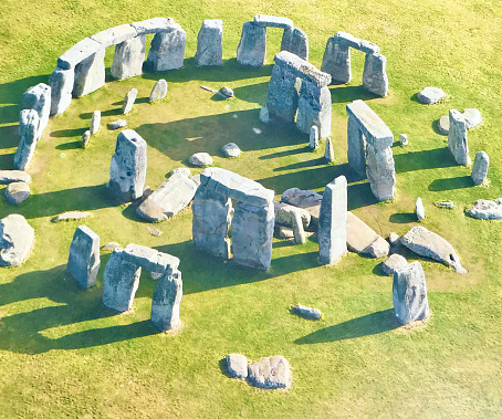 Crescent moon over the ancient Stonehenge stone circle in Wiltshire, England