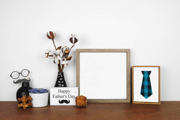 istock Mock up wood frame with rustic Fathers Day decor on a wood shelf against a white wall 1315875369