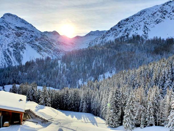 istock Sunrise above snow-covered fir trees 1315876979