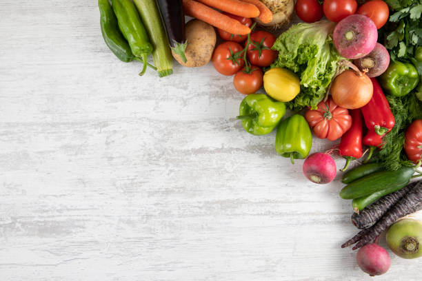 istock Fresh Vegetables on Wooden Background 1315883995