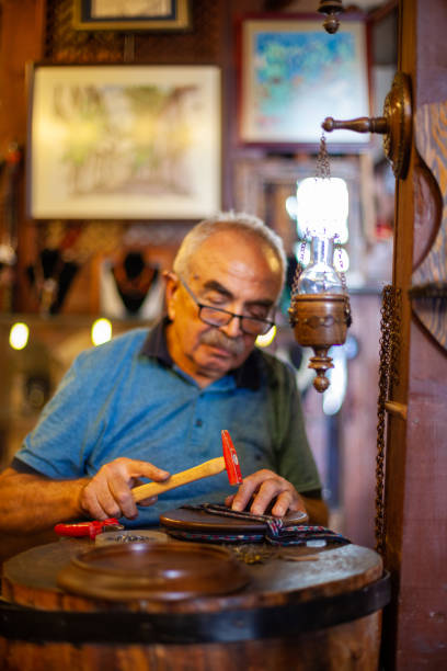 istock Experienced mature man dealing with woodworking 1315884035