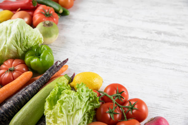 istock Fresh and Raw Vegetables on Wooden Background 1315884317