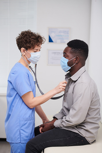 Doctor Checking Health Of Patient