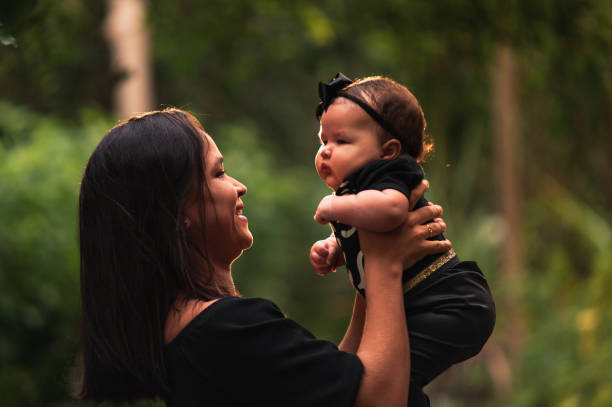 istock Mother holding daughter in arm 1315887019