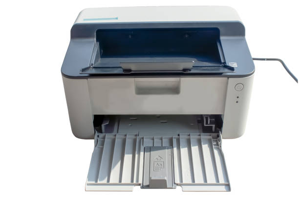 istock Square white laser printer with protruding paper tray and power cable, isolate. 1315888526